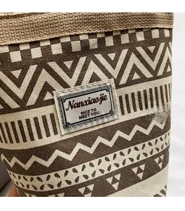 Close-up of ethnic canvas bucket bag with geometric prints and fabric brand label