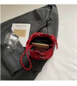 Internal view of red floral drawstring bucket bag showing spacious storage for essentials
