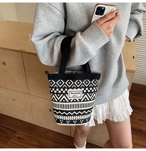 Canvas bucket bag detail with geometric patterns and Nanxiaojie logo label
