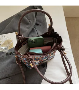 Top view of retro woven bucket bag showing spacious interior for phone and wallet