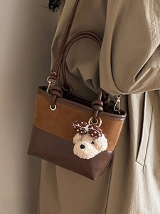 Vintage two-tone bucket bag in brown suede and leather with a cute bear charm