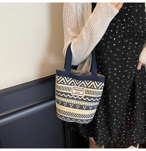 Close-up of ethnic canvas tote bag with geometric patterns and Nanxiaojie label