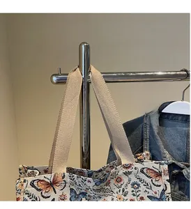 Detail of vintage jacquard tote bag with butterfly embroidery and thick woven handles