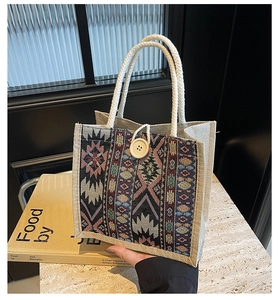 Close-up of ethnic jacquard pattern tote bag with rope handle and button closure