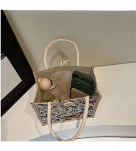 Linen tote bag interior showing ample space for an umbrella, phones and wallet