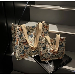 Detailed macro view of retro floral butterfly jacquard fabric and cotton web handles