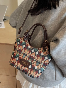 Chic quilted geometric woven bucket bag with leather handles and crossbody strap