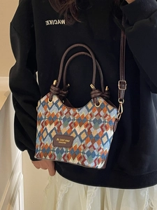 Retro geometric patchwork tapestry bucket bag with brown leather handles and strap