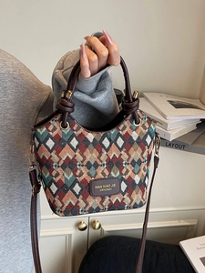 Chic quilted bucket bag with geometric knit pattern and leather handles for women