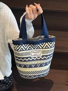 Ethnic style canvas bucket bag with geometric patterns and blue floral print