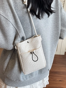 Chic cream woven crossbody phone bag for women with drawstring pocket and slim strap