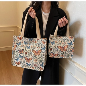 Detail view of large and small vintage floral butterfly print fabric tote bag set