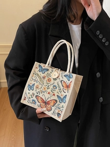 Linen tote bag with floral butterfly embroidery and woven rope handle for women