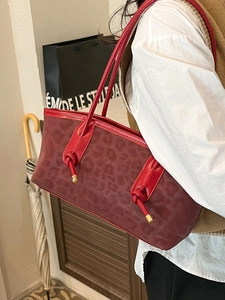 Large burgundy shoulder tote bag with leopard texture and elegant knotted handles