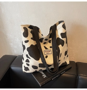 Detail of the high-quality corduroy material and cow print texture on this tote bag