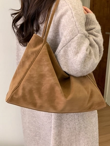 Large minimalist dark camel tote bag for women showing triangular suede texture design