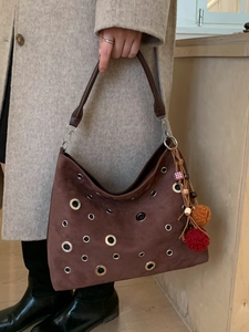 Brown suede hobo bag with silver metal grommets and colorful charms for women