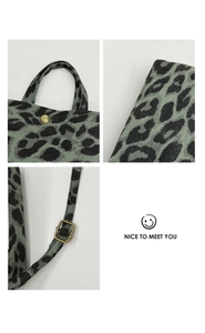Detailed views of canvas leopard print bag with brass snaps and adjustable strap