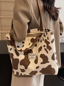 Fashionable corduroy cow print tote bag for women featuring large capacity and shoulder strap