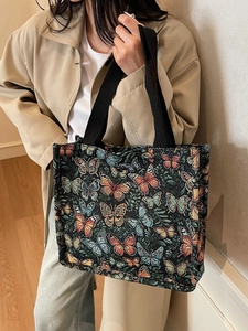 Large capacity tote bag with colorful butterfly pattern and black woven handles
