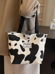 Chic corduroy cow print tote bag with large capacity and stylish black top handles