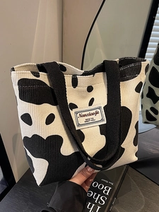 Large capacity corduroy tote bag with cow print pattern and durable black ribbon handles