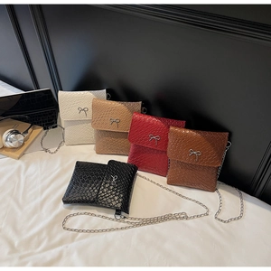Detailed close-up showing five available colors of stylish bow-knot mini shoulder bags