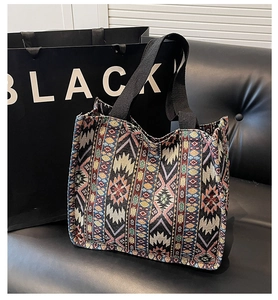 Close-up of ethnic tote bag with intricate geometric jacquard patterns and wide handles
