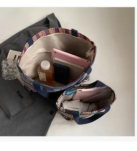 Large and small canvas bucket bags showing spacious interior and vintage jacquard pattern