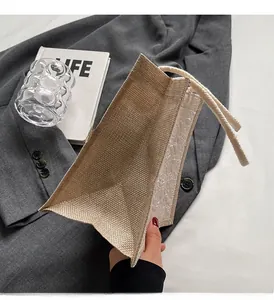 Detail of linen handbag showing side structure and textured lining with rope handle