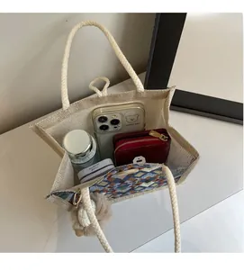 Spacious interior of waterproof linen tote bag showing phone, wallet, and water bottle