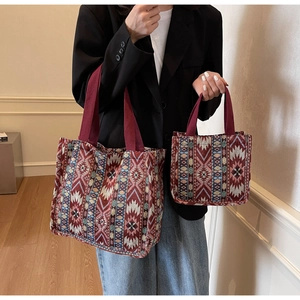 Detailed macro of ethnic tote bags showing woven geometric patterns in two sizes