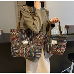 Detail view of large and small bohemian chevron woven canvas bags for women