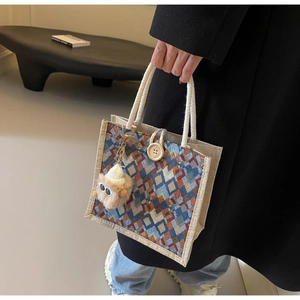 Linen handbag featuring geometric diamond pattern, cotton rope handle and wooden button detail