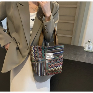 Close-up of colorful chevron jacquard pattern and premium fabric on small bucket tote bag