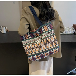 Detail of vintage geometric jacquard tote bag featuring retro ethnic weaving patterns