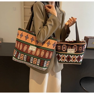 Detail of ethnic jacquard woven canvas tote bag set with geometric patterns and logos