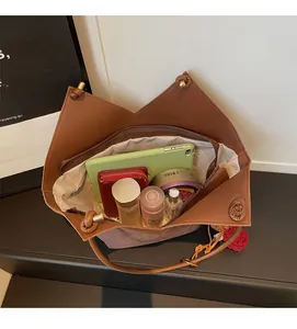Interior view of brown leopard tote bag showing spacious capacity and zipper pocket