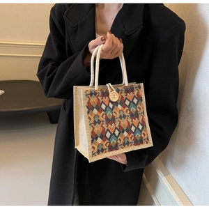 Close-up of geometric pattern weave on linen tote bag with cotton rope handles