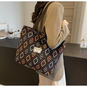 Detail of vintage geometric canvas tote bag showing textured weave and retro pattern