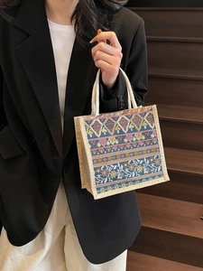 Bohemian colorful woven handbag with geometric floral patterns and rope handles