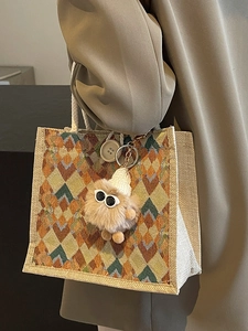 Linen tote bag with geometric diamond pattern and plush monster charm for women