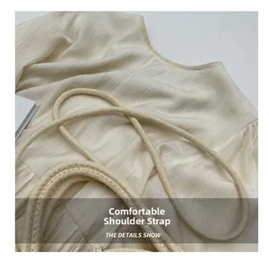 Detail of cream striped fabric with natural thick rope woven shoulder straps