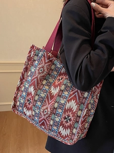 Ethnic woven tote bag with red and blue geometric patterns for daily commute use