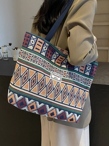 Ethnic geometric canvas bucket bag with colorful woven patterns and sturdy handles