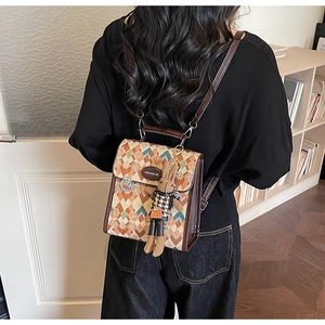 Retro geometric rhombus fabric backpack shown on model with cute rabbit keychain detail