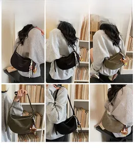 Minimalist crescent shoulder bag in black and olive green with cute bear charms