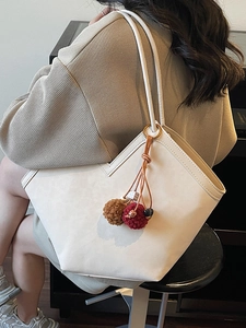 Chic beige faux leather large tote bag with leopard print interior and tassel detail