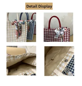 Detail view of houndstooth tote bags with magnetic closure, inner zip pocket and silk scarf