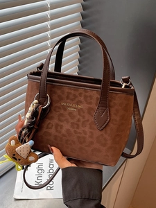 Retro leopard print tote bag with plush bear charm for autumn and winter commuters